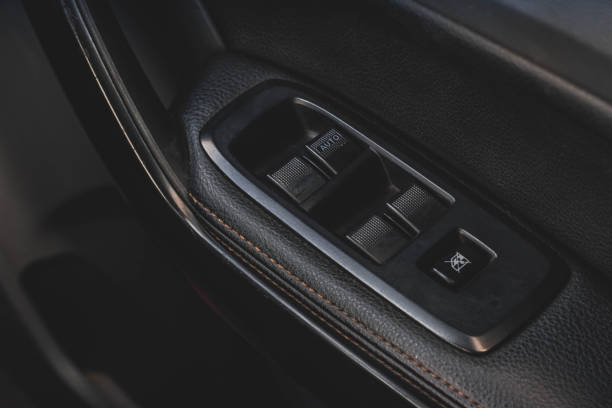 istock Car arm rest with Control Panel. Door Lock & Mirror Control. window adjustment buttons, door lock. Photography of a modern car. 1281951805