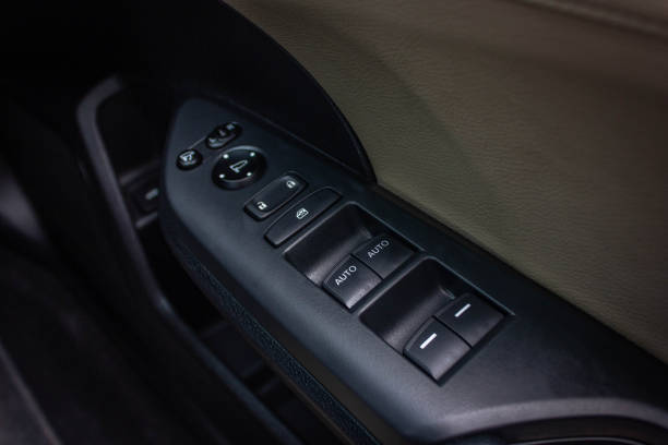 istock Car arm rest with Control Panel. Door Lock & Mirror Control. window adjustment buttons, door lock. Photography of a modern car. 1281951819