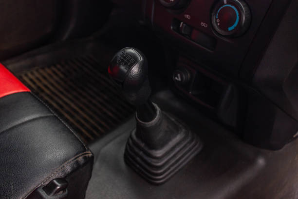 istock automatic transmission shift selector in the car interior. Closeup a manual shift of modern car gear shifter. 1281951822