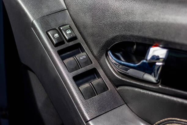 istock Car arm rest with Control Panel. Door Lock & Mirror Control. window adjustment buttons, door lock. Photography of a modern car. 1281951825