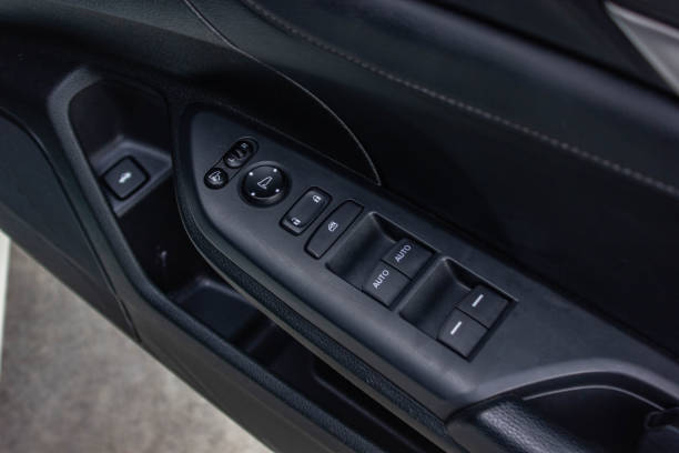istock Car arm rest with Control Panel. Door Lock & Mirror Control. window adjustment buttons, door lock. Photography of a modern car. 1281951829