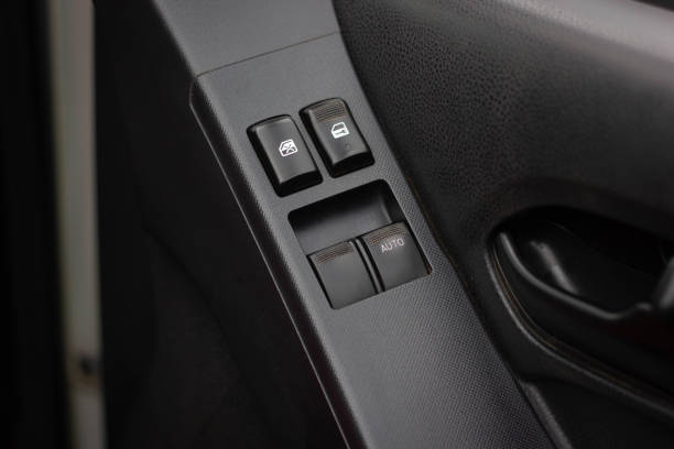 istock Car arm rest with Control Panel. Door Lock & Mirror Control. window adjustment buttons, door lock. Photography of a modern car. 1281951839