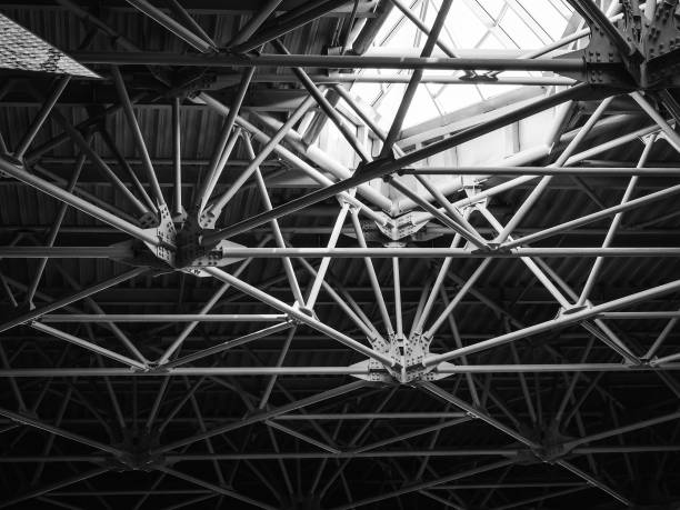 istock ceiling with metal structures in a modern building - geometry in architecture. Black and white photo 1281952175