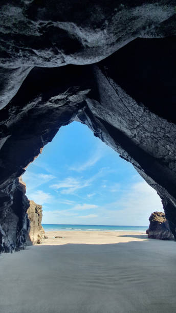 cave at a beach near orzola, lanzarote, spain - lanzarote bay canary islands beach imagens e fotografias de stock