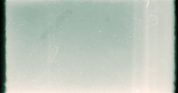 istock Noisy film frame with heavy scratches, dust and grain 1281953333