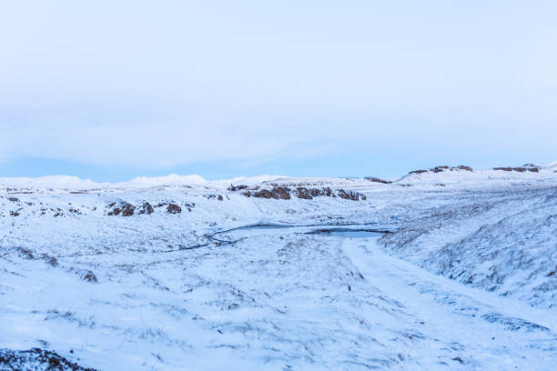 istock Iceland's incredible fields and plains landscape in winter. The ground is covered with snow. Large spaces. The beauty of winter nature 1281954005