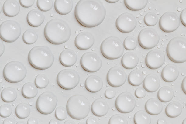 istock Big and small water drops on gray background. Closeup. 1281954098