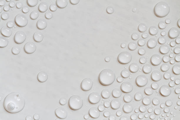 istock Big and small water drops on gray background. Closeup. 1281954103