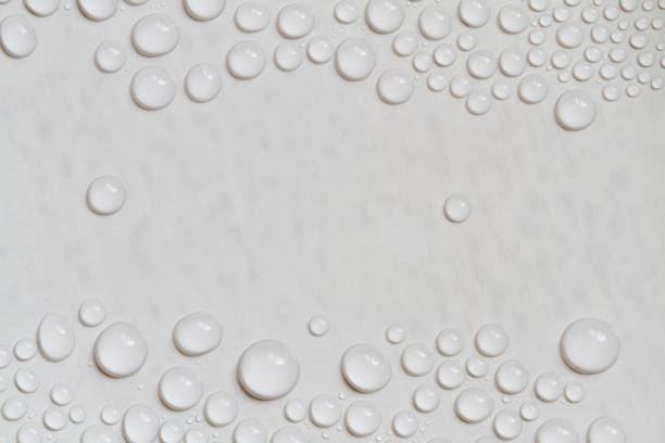istock Big and small water drops on gray background with copy space. Closeup. 1281954104