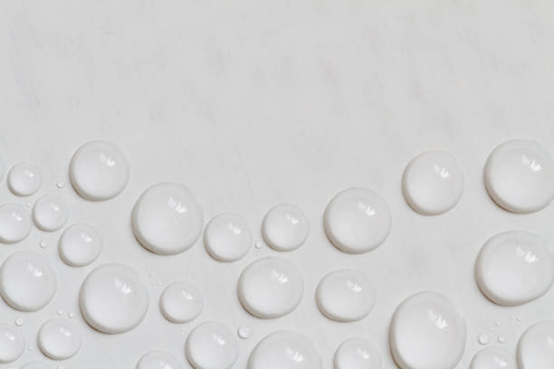 istock Big and small water drops on gray background with copy space. Closeup. 1281954171