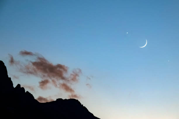 istock Moon and star are together in the sky. 1281955140