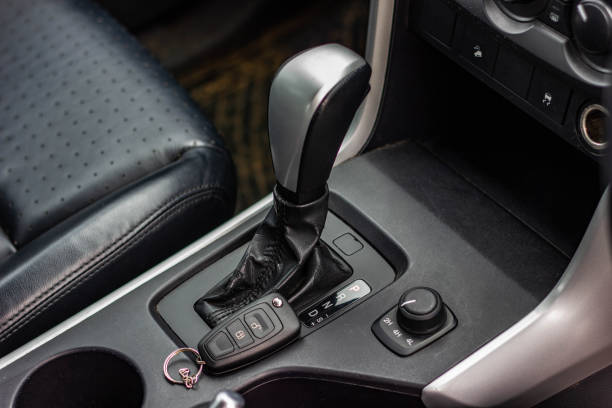 automatic transmission shift selector in the car interior. Closeup a manual shift of modern car gear sifter.