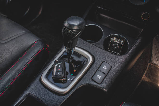 istock automatic transmission shift selector in the car interior. Closeup a manual shift of modern car gear sifter. 1281957585