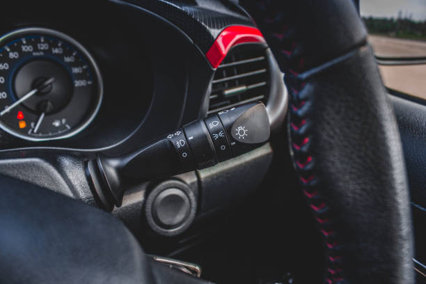 istock Switch off lights in a car. close-up Car integrated turning indicator with headlight switch toggle. 1281957590