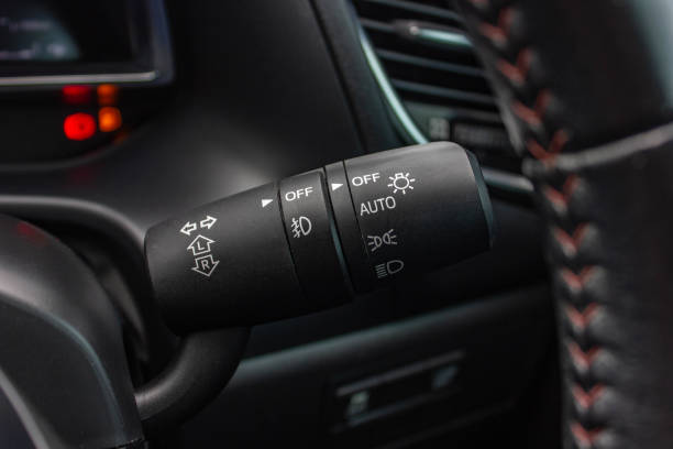 istock Switch off lights in a car. close-up Car integrated turning indicator with headlight switch toggle. 1281957593
