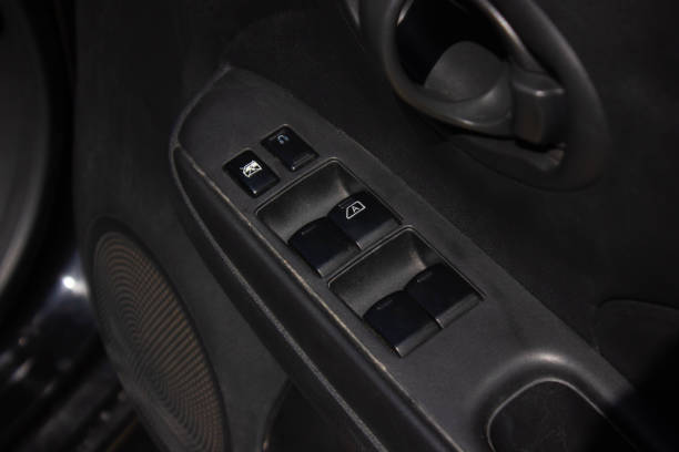 istock Car arm rest with Control Panel. Door Lock & Mirror Control. window adjustment buttons, door lock. Photography of a modern car. 1281957597