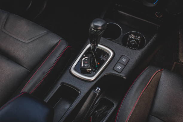 istock automatic transmission shift selector in the car interior. Closeup a manual shift of modern car gear sifter. 1281957611