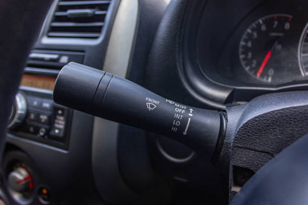 istock Windscreen wiper control switch in car. Wipers control. Modern car interior detail. adjusting speed of screen wipers in car. 1281957624