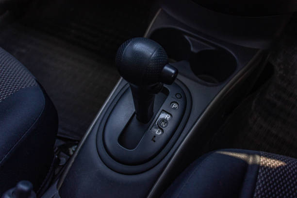 istock automatic transmission shift selector in the car interior. Closeup a manual shift of modern car gear sifter. 1281957632