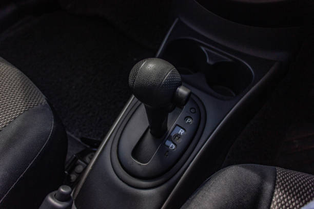 istock automatic transmission shift selector in the car interior. Closeup a manual shift of modern car gear sifter. 1281957640