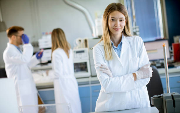 istock Female scientist in white lab coat standing in the biomedical lab 1281958266