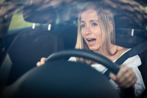 istock Pretty middle aged woman at the steering wheel 1281958566