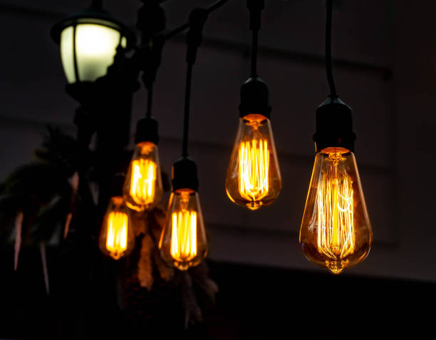 istock Luminous retro bulbs on suspensions, vintage style 1281962045