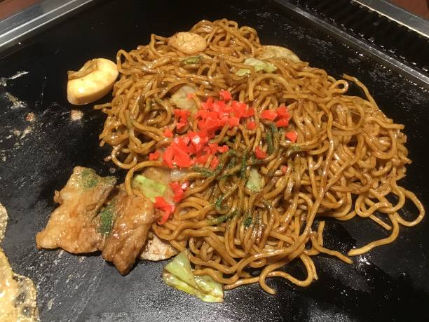 istock Yakisoba cooked on an iron plate and cooked with a spatula 1281962806
