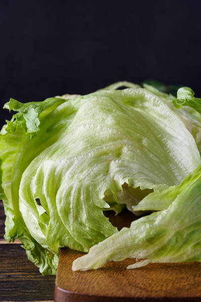 istock Fresh lettuce on wooden table 1281962850