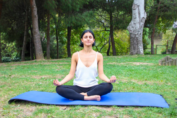 istock young woman doing lotus position 1281966522