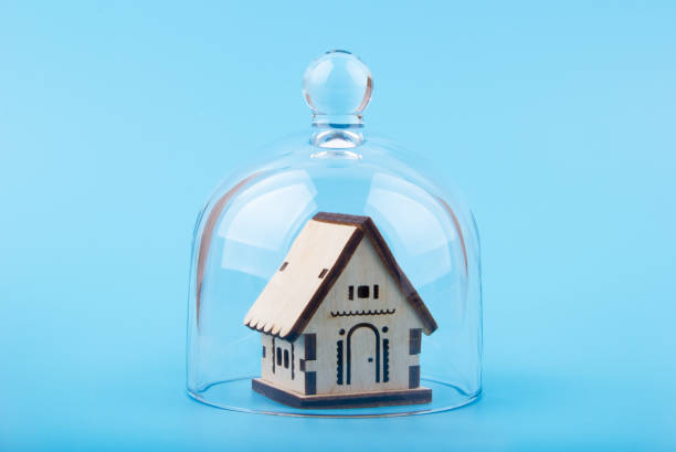 istock Model of house on a glass dome 1281969236