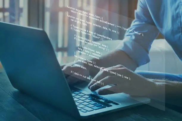 Photo of programmer writing programming code