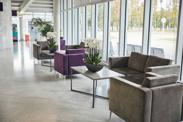 istock Empty airport terminal waiting area with comfortable furniture 1281970124