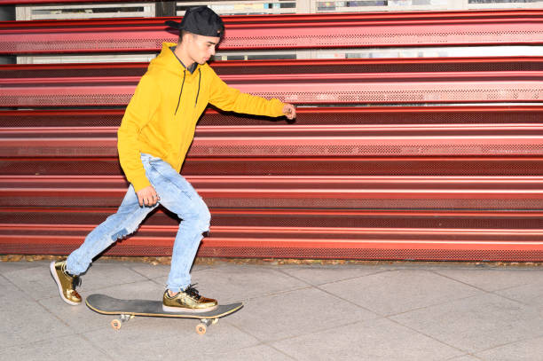 Skateboard, motion blur and man speed on road for sports competition, training and exercise in city. Skating, skateboarding and male skater ride for adrenaline, adventure and freedom for challenge