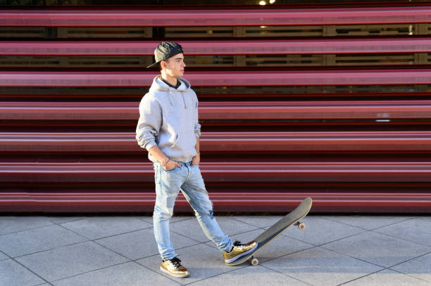 Skateboard man in shoes and jeans getting ready to jump