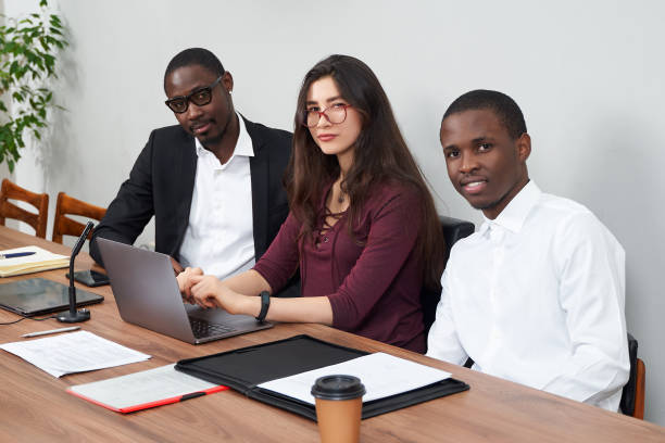 istock Young happy business people working together in modern office, multiethnic teamwork 1281972445