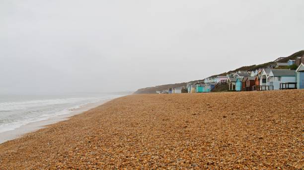 istock Row of colourful huts at beach 1281972582