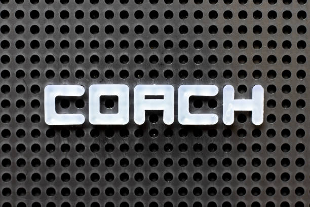 istock White color alphabet with word coach on black pegboard background 1281973423