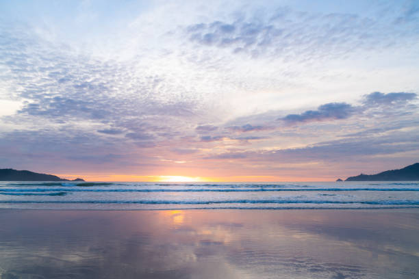 istock Sunlight sunset on horizon ocean on background seascape atmosphere rays sunrise. Relax view waves sea on evening sand beach, sun light flare nature evening outdoor vacation concept, copy space 1281975907
