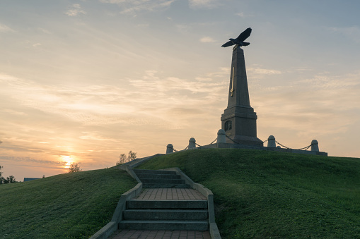 Monument to Kutuzov on the Borodino field during the summer sunset