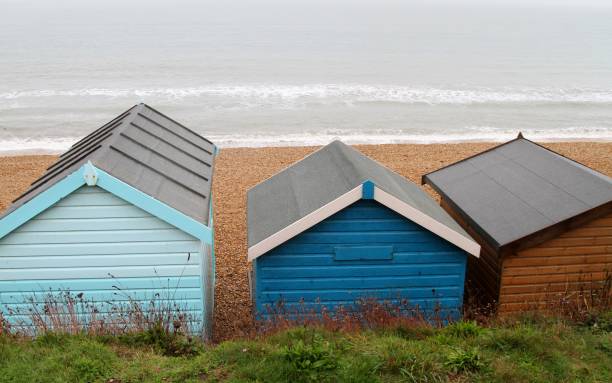 istock Beach huts and waves on winter day at beach 1281977478