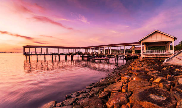 istock Jelutong Expressway's shore view during purple sunrise 1281981656