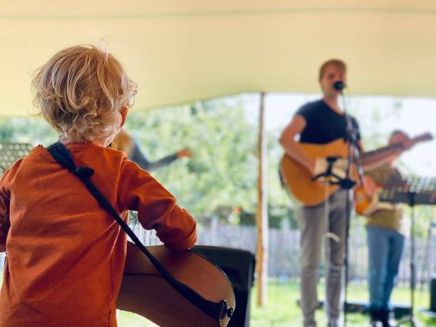 istock Father and toddler son on guitar 1281983141