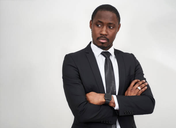istock Successful confident african american businessman with folded arms with copy space 1281984636