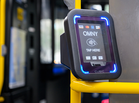New York, New York, USA - October 23, 2020: An OMNY terminal on a bus allowing tap to pay of bus fare.