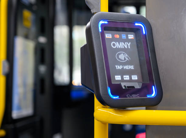 OMNY Tap to Pay New York City Bus New York, New York, USA - October 23, 2020: An OMNY terminal on a bus allowing tap to pay of bus fare. american express stock pictures, royalty-free photos & images