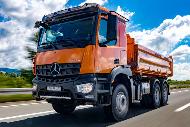Mercedes Arocs 2643 dumper truck driving stock photo