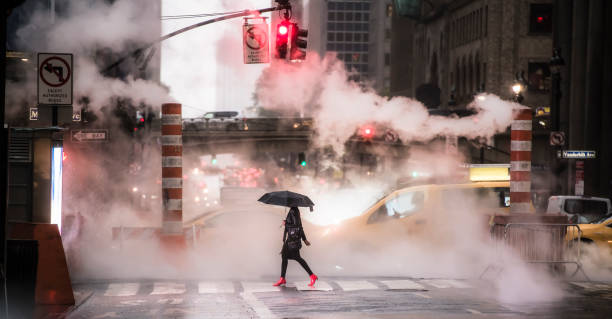 A woman wearing red high heels is crossing the 42nd street in Manhattan during the Covid-19 outbreak. Manhattan, New York City, United States. New York, USA, October 04, 2020. A woman wearing red high heels is crossing the 42nd street in Manhattan during the Covid-19 outbreak. Manhattan, New York City, United States. 42nd street photos stock pictures, royalty-free photos & images