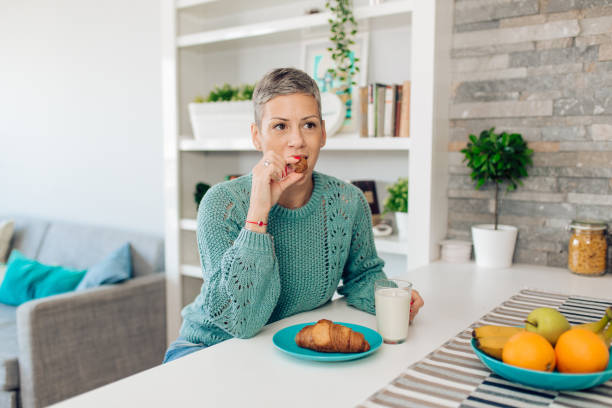 istock Woman having breakfast at home 1281989504