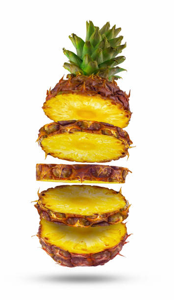 istock Flying pineapple. Pieces if sliced pineapple flying in the air. Isolated. 1281990945